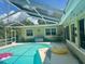 Inviting screened-in pool area with plenty of space for relaxation at 1624 Sea Breeze Dr, Tarpon Springs, FL 34689