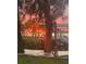 Beautiful sunset view from waterfront property with boat in the distance at 1624 Sea Breeze Dr, Tarpon Springs, FL 34689