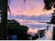 Scenic waterfront sunset with a canoe at 1624 Sea Breeze Dr, Tarpon Springs, FL 34689