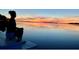 Tranquil waterfront view at sunset at 1624 Sea Breeze Dr, Tarpon Springs, FL 34689