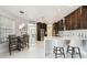 Eat-in kitchen with breakfast bar and modern design at 18325 Daventry Ct, Hudson, FL 34667