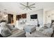 Bright and airy living room with a stylish built-in media wall and comfortable seating at 18325 Daventry Ct, Hudson, FL 34667