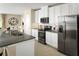 Modern kitchen with stainless steel appliances and granite countertops at 2467 White Ladyfish Rd, Wimauma, FL 33598