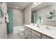 Bathroom boasts double sinks, a bathtub, and teal accents at 2473 White Ladyfish Rd, Wimauma, FL 33598