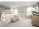 Bright and airy Primary bedroom with a king-size bed and natural light at 2473 White Ladyfish Rd, Wimauma, FL 33598
