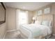 Spacious bedroom with a king-size bed and light, airy decor at 2473 White Ladyfish Rd, Wimauma, FL 33598