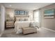 Serene bedroom with a king-size bed and neutral color palette at 2473 White Ladyfish Rd, Wimauma, FL 33598