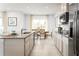 Modern kitchen with granite countertops and stainless steel appliances at 2473 White Ladyfish Rd, Wimauma, FL 33598