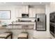 Modern kitchen with stainless steel appliances and granite countertops at 2473 White Ladyfish Rd, Wimauma, FL 33598