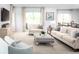 Spacious living room with large windows and comfortable seating at 2473 White Ladyfish Rd, Wimauma, FL 33598