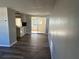 Dining area with wood-look floors and access to a sunroom at 3818 Haven Dr, New Port Richey, FL 34652