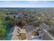 Aerial view of a villa community showcasing a single-story home with surrounding landscape at 410 Candlestone Ct, Spring Hill, FL 34609