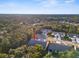 An aerial view showcasing a single story home in a community setting with lush landscaping at 410 Candlestone Ct, Spring Hill, FL 34609