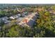 Aerial view of a villa, showing its location within a community of similar homes at 410 Candlestone Ct, Spring Hill, FL 34609