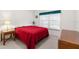 Guest bedroom with full-size bed and wood nightstand at 410 Candlestone Ct, Spring Hill, FL 34609