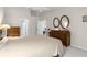 Large bedroom with king-size bed and ample dresser space at 410 Candlestone Ct, Spring Hill, FL 34609