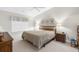 Spacious Primary bedroom with king-size bed and wood furniture at 410 Candlestone Ct, Spring Hill, FL 34609