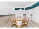 Cozy breakfast nook with wood table and four chairs at 410 Candlestone Ct, Spring Hill, FL 34609