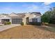 Cute two-bedroom villa with a screened-in porch and attached garage at 410 Candlestone Ct, Spring Hill, FL 34609
