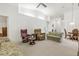 Open living space with comfortable seating and access to dining area at 410 Candlestone Ct, Spring Hill, FL 34609
