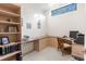 Home office with built-in desk and abundant shelving at 410 Candlestone Ct, Spring Hill, FL 34609
