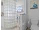 Bathroom with a glass block shower and built-in shelving at 4225 Carlos Ct, Hernando Beach, FL 34607