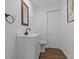 Clean bathroom with white vanity, dark hardware, and updated flooring at 4225 Carlos Ct, Hernando Beach, FL 34607