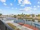 Tranquil waterfront view with private dock and neighboring houses at 4225 Carlos Ct, Hernando Beach, FL 34607