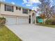 Two-story house featuring double doors and a two-car garage at 4225 Carlos Ct, Hernando Beach, FL 34607