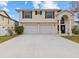 Two-story home with double garage and attractive landscaping at 4225 Carlos Ct, Hernando Beach, FL 34607