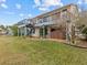 Two-story house with spiral staircase, deck, and hot tub at 4225 Carlos Ct, Hernando Beach, FL 34607