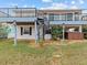 Two-story house with deck, spiral staircase, and hot tub at 4225 Carlos Ct, Hernando Beach, FL 34607