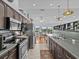 Modern kitchen with stainless steel appliances and dark cabinets at 4225 Carlos Ct, Hernando Beach, FL 34607