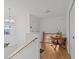 Bright landing with a wooden table and stairs at 4225 Carlos Ct, Hernando Beach, FL 34607