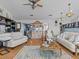 Open living room featuring hardwood floors and multiple seating areas at 4225 Carlos Ct, Hernando Beach, FL 34607