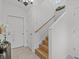 Modern staircase with wood treads and white walls at 4225 Carlos Ct, Hernando Beach, FL 34607