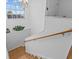 Elegant staircase with wooden handrail at 4225 Carlos Ct, Hernando Beach, FL 34607