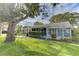 Spacious backyard with patio and lush green grass at 4710 Parkdale Ln, New Port Richey, FL 34655