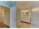 Bathroom with white cabinets and wood-look flooring at 4710 Parkdale Ln, New Port Richey, FL 34655