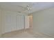 Bedroom with built-in closet and access to bathroom at 4710 Parkdale Ln, New Port Richey, FL 34655