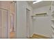 Bright white closet with shelving and mirrored doors at 4710 Parkdale Ln, New Port Richey, FL 34655