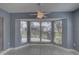 Bright dining room with a bay window and tile floor at 4710 Parkdale Ln, New Port Richey, FL 34655
