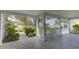 Spacious covered porch offering views of the neighborhood at 4710 Parkdale Ln, New Port Richey, FL 34655