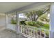 Covered porch overlooking a lush, tree-filled yard at 4710 Parkdale Ln, New Port Richey, FL 34655