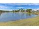 Serene lake view with fountain and lush greenery at 4710 Parkdale Ln, New Port Richey, FL 34655