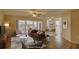 Virtually staged living room with a brown leather sofa and hardwood floors at 4710 Parkdale Ln, New Port Richey, FL 34655