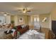 Virtually staged living room with hardwood floors and a cozy atmosphere at 4710 Parkdale Ln, New Port Richey, FL 34655