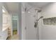 Updated shower with double shower heads and herringbone tile at 4710 Parkdale Ln, New Port Richey, FL 34655