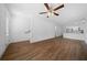 Spacious living room featuring modern ceiling fan and beautiful wood-look floors at 5173 Pacific Ave, Spring Hill, FL 34607
