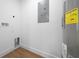 Small utility closet showing a water heater, and energy guide for an energy-efficient water heater at 5173 Pacific Ave, Spring Hill, FL 34607